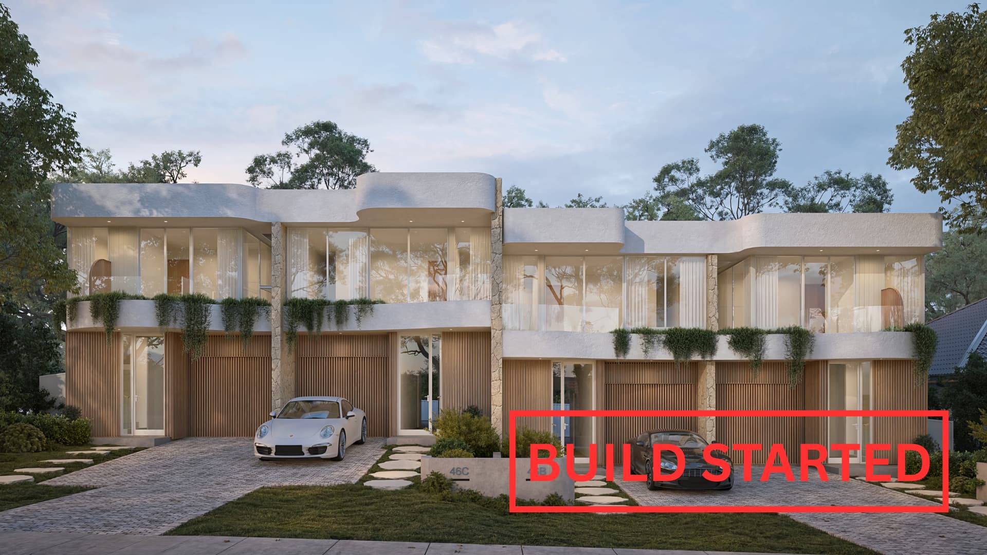 Architectural render of four luxury terrace homes with timber screens and greenery at dusk in Woolooware