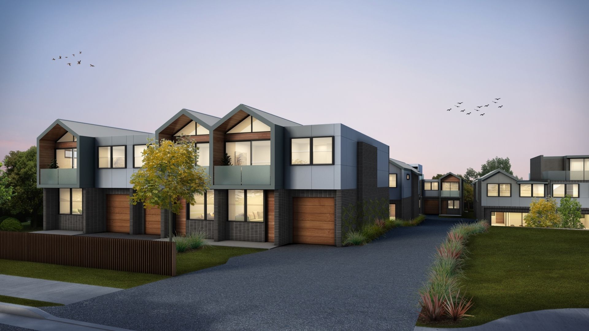 Architectural render of a row of contemporary townhouses at dusk in Warnervale